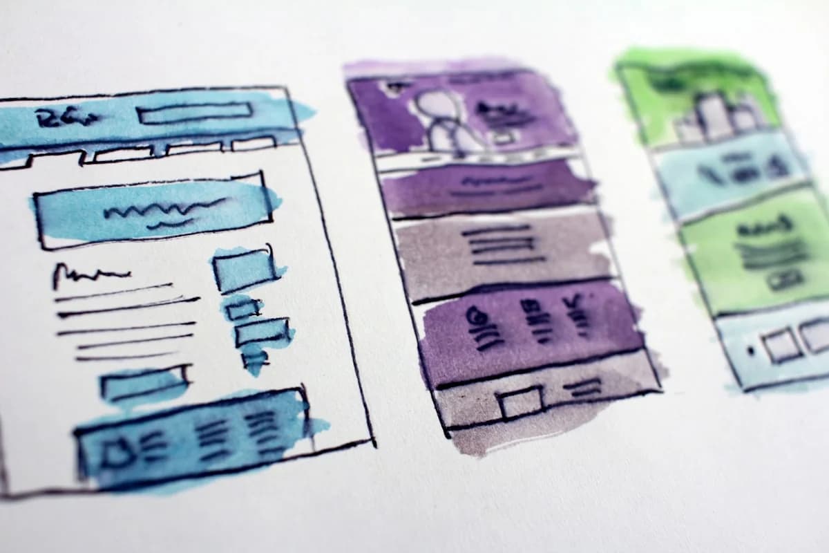 Design team collaborating on modern typography, colour systems, and page layouts for web redesign